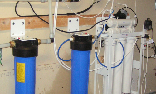 Reverse osmosis water filtration system in Pleasant Grove, UT, close-up of filtration unit components.